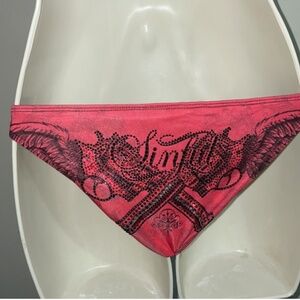 Sinful by affliction metal rhinestone weapon gun cross wings